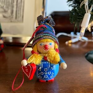 Vintage Steinbach girl holding heart with knit hat and braids